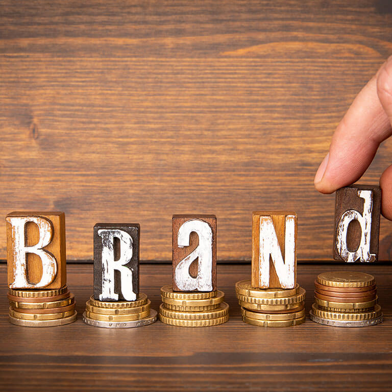 The word brand is spelled out with wooden letters. 